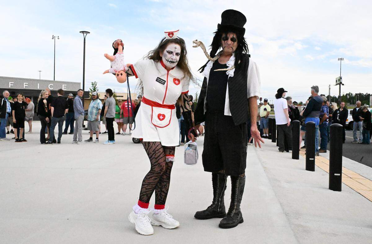 Barby Byrd (left) dressed as Nurse Rozetta and Dagon Bytes dressed as Alice Cooper, from Shady Dale, Georgia, pose before the start of An Evening with Alice Cooper on Saturday, May 3, 2025, at Atrium Health Amphitheater in Macon, Georgia. (Photo/Alba Rosa)