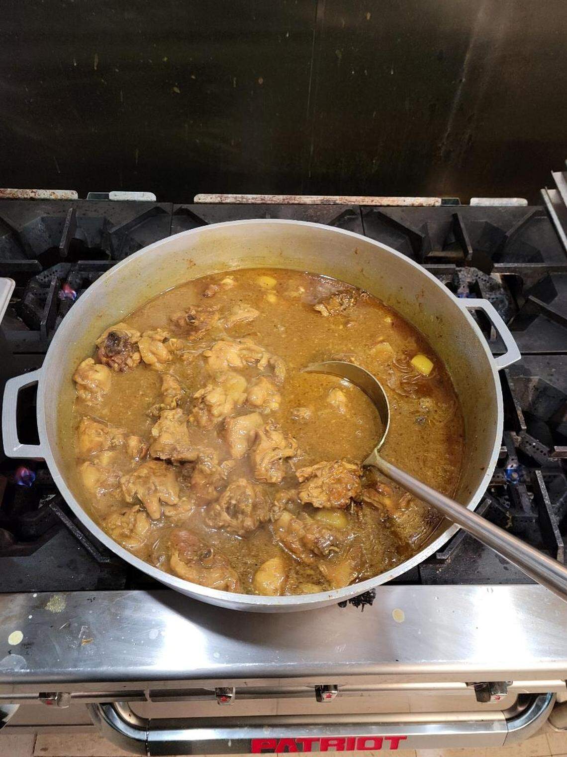 Curry chicken on the stove at J & F Caribbean Delight at 100 Gunn Road in Centerville.