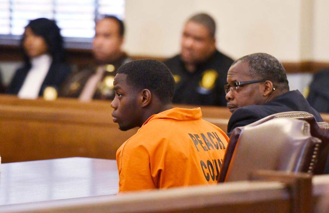 JASON VORHEES/THE TELEGRAPH Macon, GA, 02/21/2020: Demarcus D. Little, 23, listens to his attorney Adrian Patrick in a Peach County Superior Court during his first appearance in where he faces charges of damaging the car of girlfriend Anitra Gunn, who disappeared Feb. 14 and was found dead Tuesday.