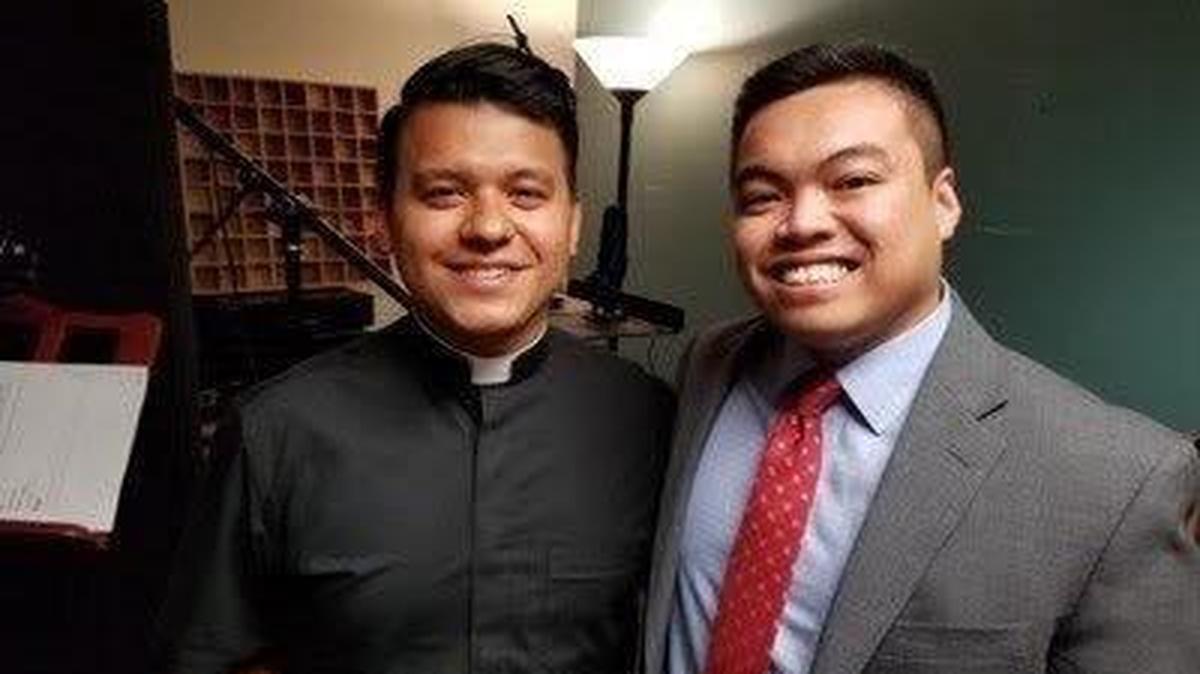 Raymond Partolan, right, stands with Father Rey Pineda after recording their stories for the album “American Dreamers: Voices of Hope, Music of Freedom,” which won three Grammys.