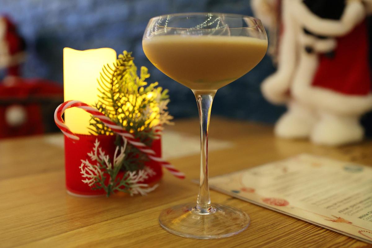 Blitzen Bar’s Gingerbread Espresso Martini sits on a table at Blitzen Bar, a holiday pop up bar inside of Sophia’s on Second on Thursday, Dec. 5, 2024, in Macon, Georgia. Blitzen Bar is one of two holiday themed pop up bars in Macon, which will be open through December with themed festive cocktails.
