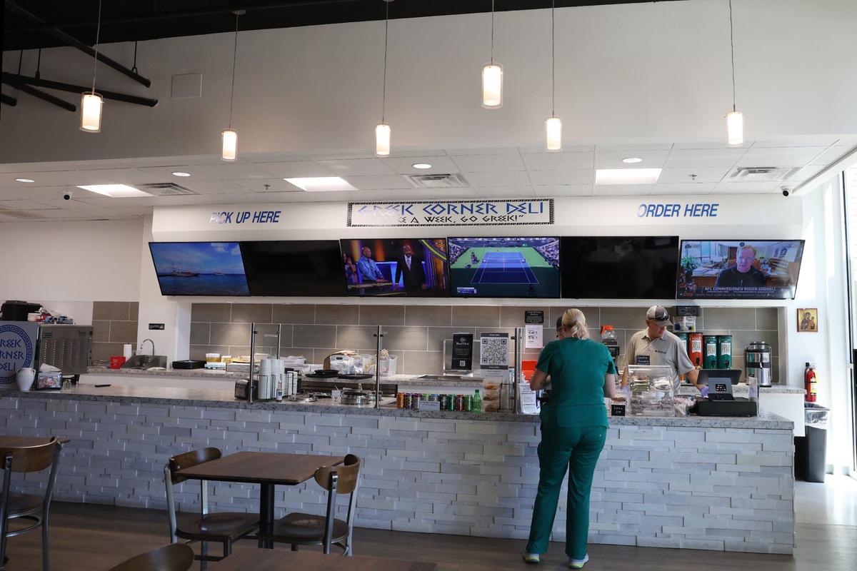 A patron orders at the counter of Greek Corner Deli on Wednesday, Sept. 4, 2024, in Macon, Georgia. Greek Corner Deli reopened in June and is now located on Spring Street after closing its downtown location in 2018.
