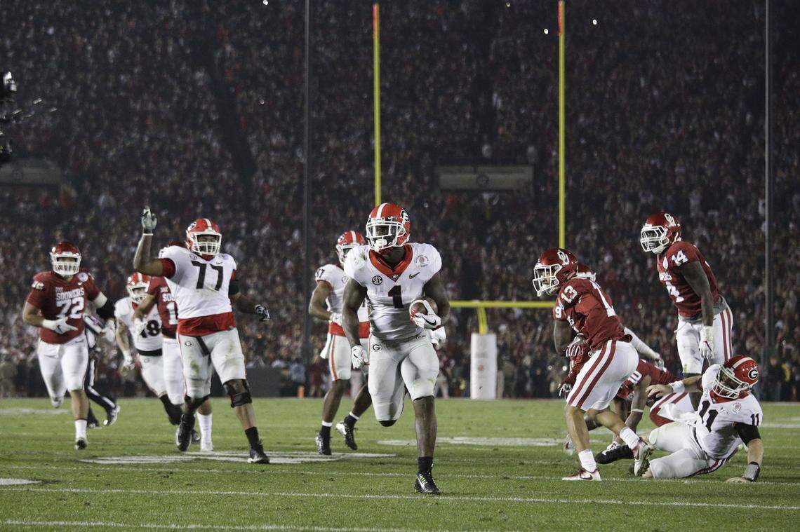 Georgia running back Sony Michel (1) carries the ball to score a touchdown in overtime against Oklahoma in the Rose Bowl NCAA college football game, Monday, Jan. 1, 2018, in Pasadena, Calif. Georgia won 54-48. (AP Photo/Jae C. Hong)