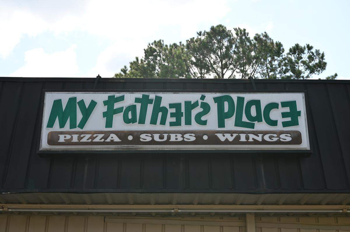 The original My Father’s Place sign above the restaurant is expected to be replaced by a new sign bearing the pizza restaurant’s new logo. Ibalz Marketing & Signs, which is in the same shopping center, is working on the sign. The company also added the restaurant’s new logo to the new My Father’s Place T-shirts.