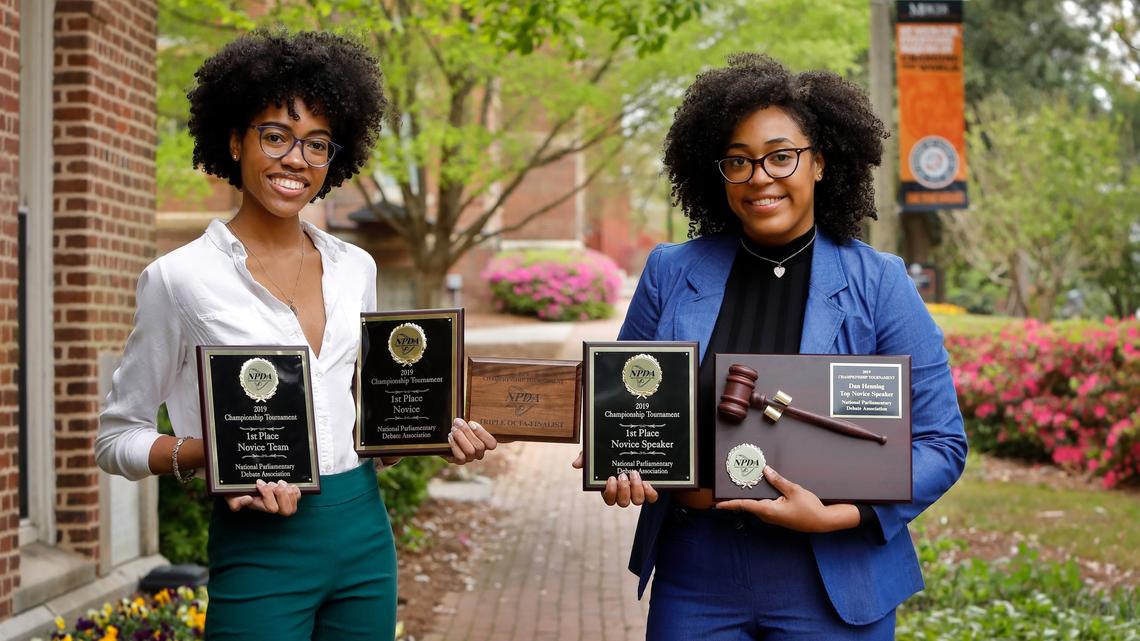 Cameron Dawkins and Yasmeen Hill, left to right, hold their awards from the National Parliamentary Debate Association National Championship Tournament. Hill won the Dan Henning Top Novice Speaker Award, and Hill and Dawkins were the first all African-American female team to win novice nationals.
