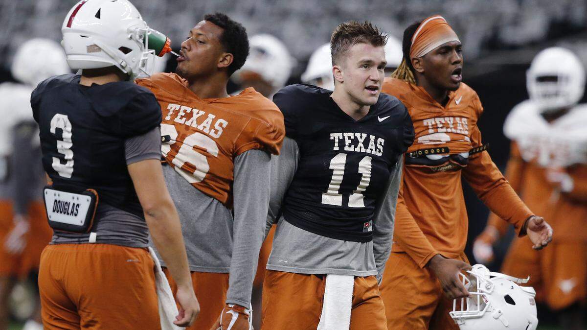 Texas quarterback Cameron Rising (3), wide receiver Jordan Pouncey (86), quarterback Sam Ehlinger (11) and wide receiver Lil’Jordan Humphrey practice at the Superdome in New Orleans, Friday, Dec. 28, 2018. Texas will face Georgia in the Sugar Bowl NCAA college football game on Jan. 1, 2019.