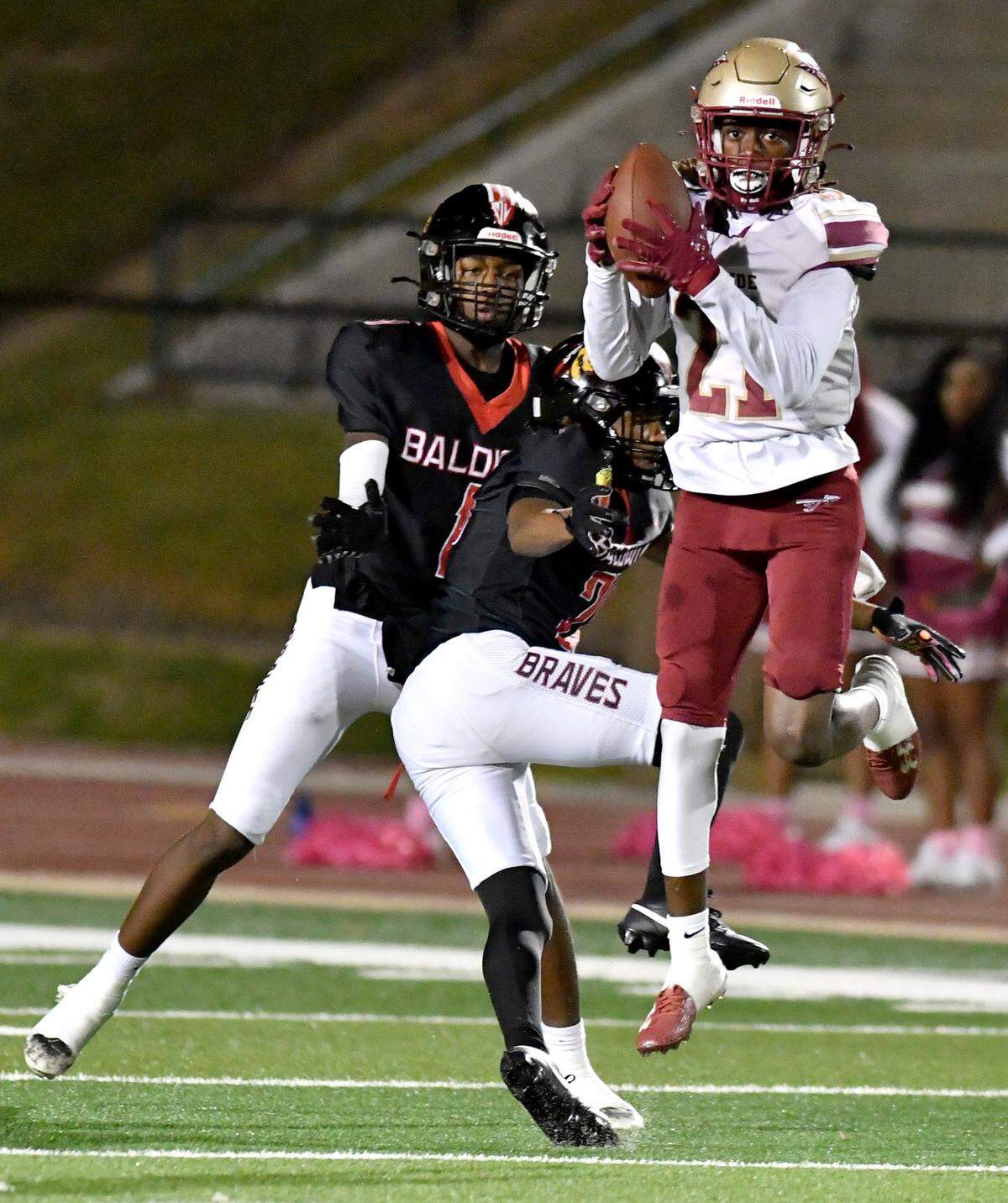 Westside’s Justin Walker (21) intercepts a pass during the Seminoles’ game at Baldwin Friday night.