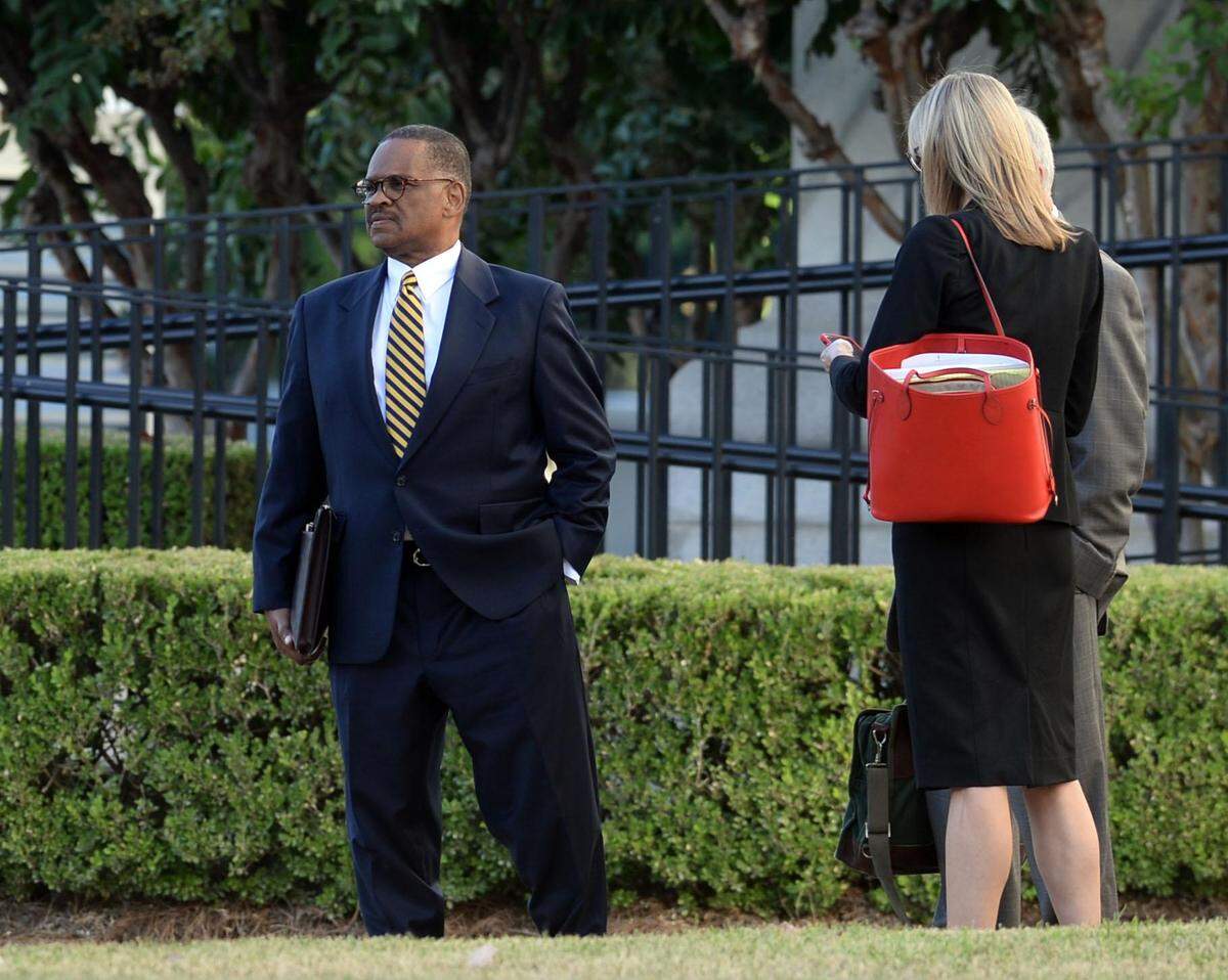 Tallahassee, Florida, attorney Harold Knowles, left, stands outside the U.S. District Courthouse Sept. 24 where he and former Macon-Bibb County Industrial Authority Chairman Cliffard Whitby are on trial on bribery and money laundering charges.