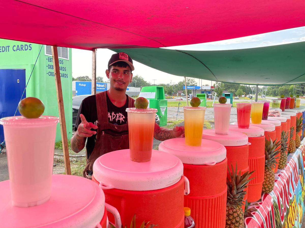 Juan Diago at his Aguas Frescas Los Cholos stand at the corner of N. Houston Road and Green St. in Warner Robins.