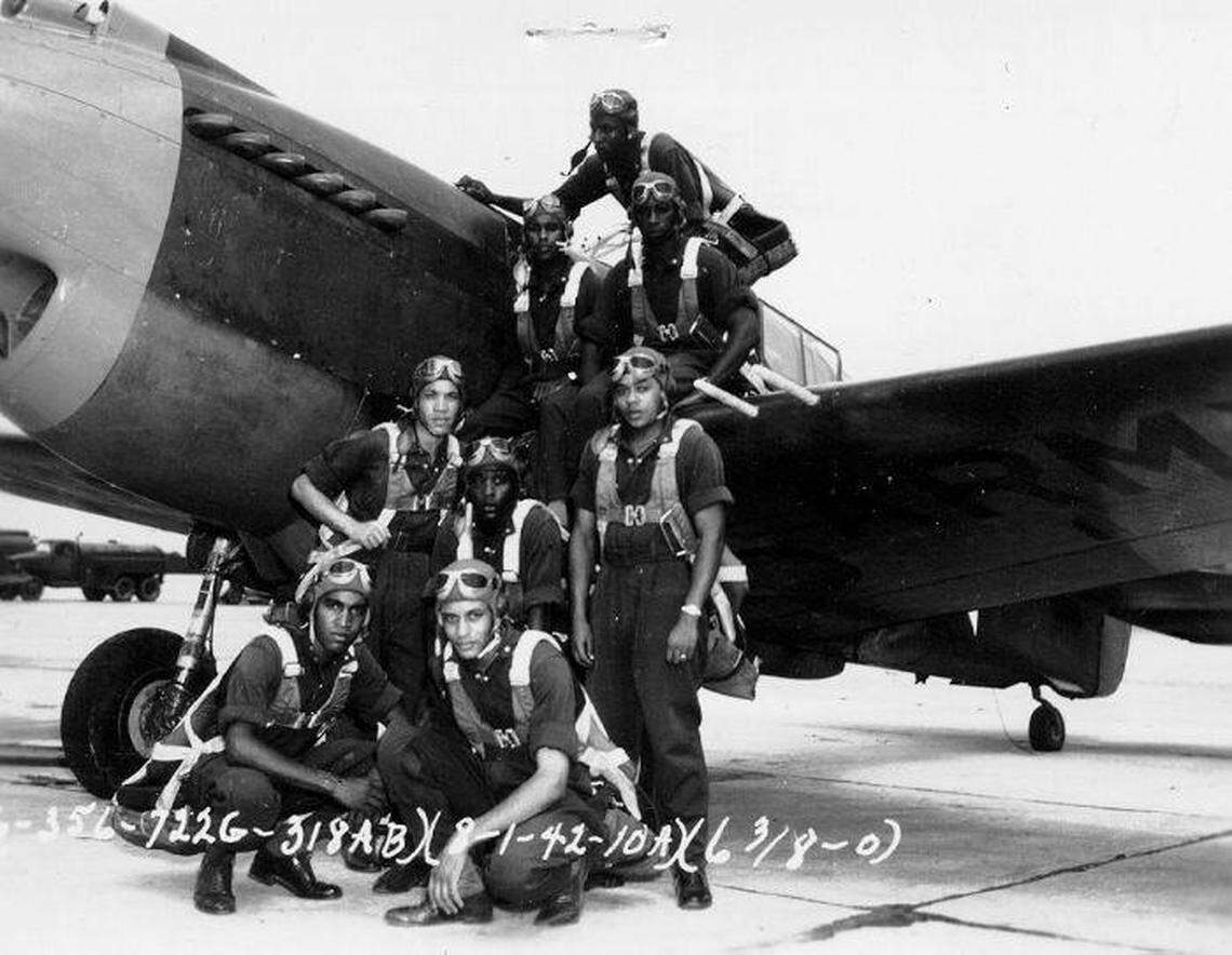Richard Davis (top, on the wing) graduated in 1942 from Advanced Flight Training at Tuskegee Army Air Field in the fifth class of African American Army Air Corp Pilots.
