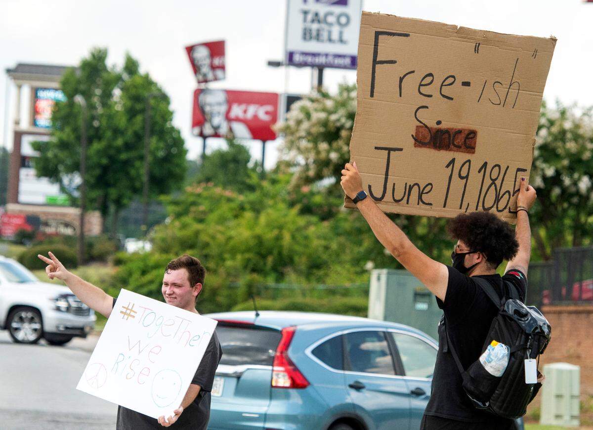 JASON VORHEES/THE TELEGRAPH Macon, GA, 06222020 Derian Wilson and Trent Perry protest for Black Lives Matter outside the Chick-fil-A on Tom Hill Sr. Blvd. June 22. Wilson, an employee at the restaurant started protesting May 31 and doesn’t plan on stopping until he sees positive change in the Country.
