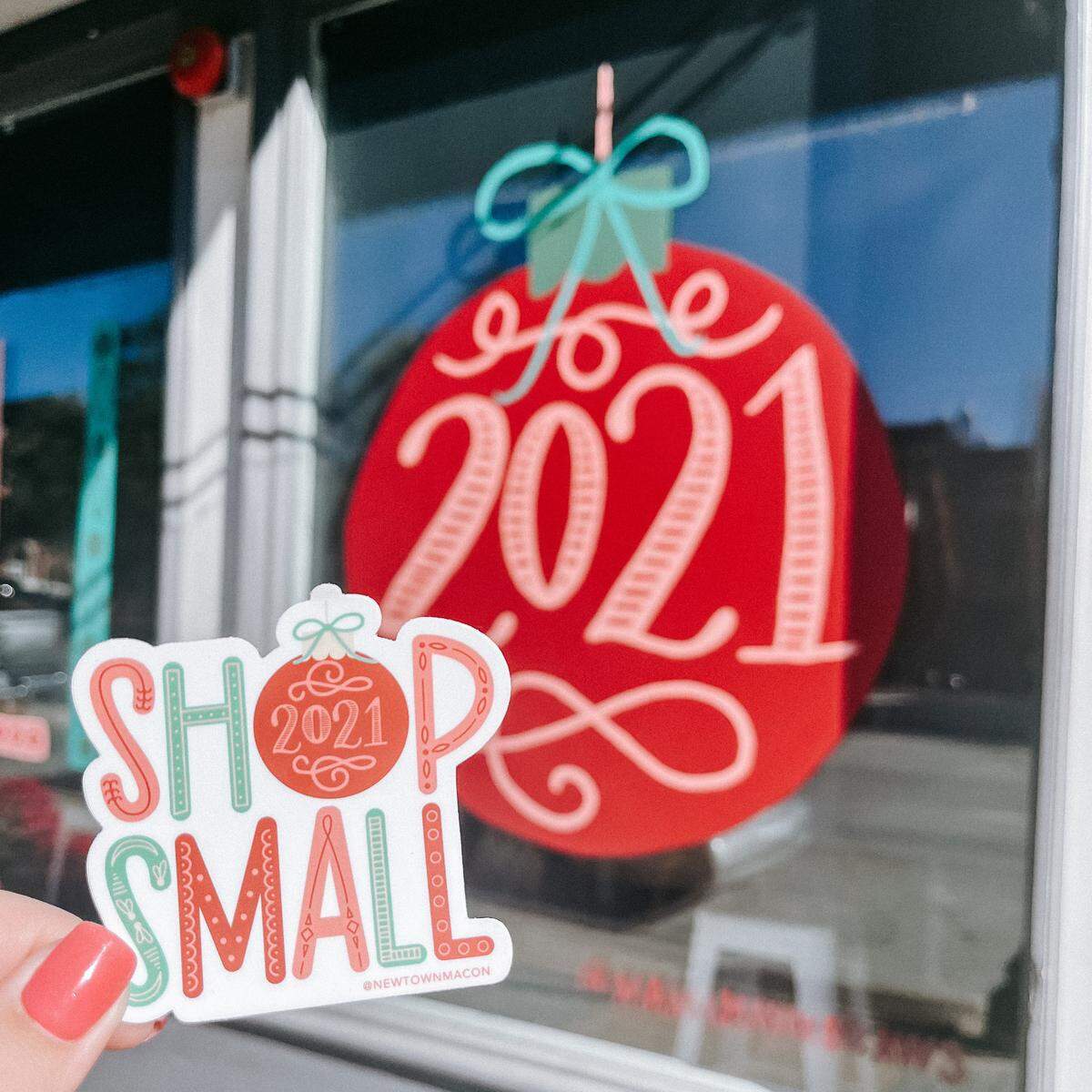 A limited edition “Shop Small 2021” sticker designed by local artist Mama Hawk Draws will be hidden in more than 20 downtown Macon stores on Saturday with each customer finding one entered in a $500 shopping spree giveaway.