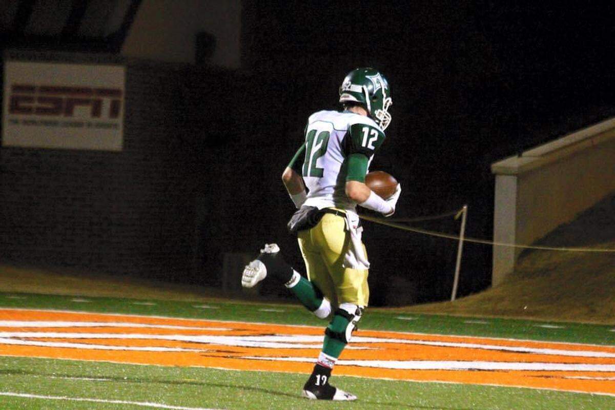 Giles Amos runs in for a touchdown in his home town of Perry. He went on to play football for the University of Alabama; he will be opening a fitness center in Macon this month.