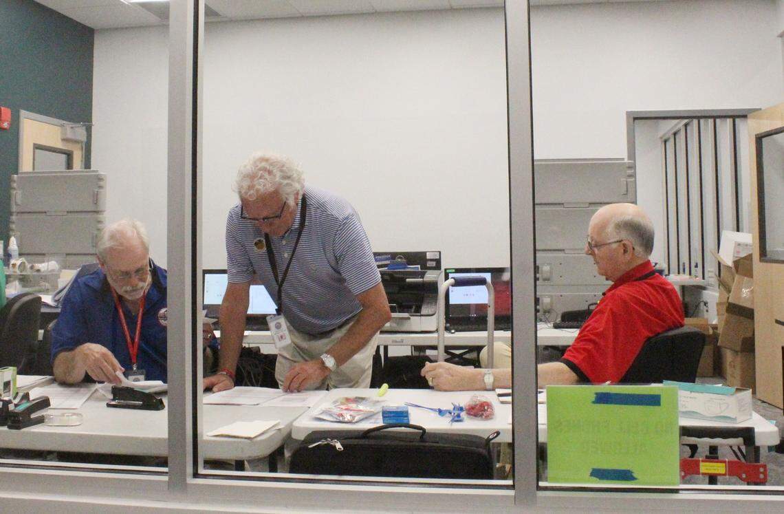 Election workers in Bibb County, Ga., tally votes at the end of Election Day on May 21, 2024. Ballot issues caused significant reporting delays from election officials.
