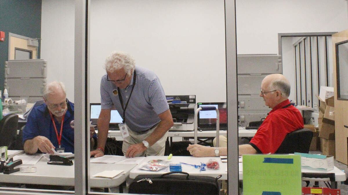 Election workers in Bibb County, Ga., tally votes at the end of Election Day on May 21, 2024. Ballot issues caused significant reporting delays from election officials.