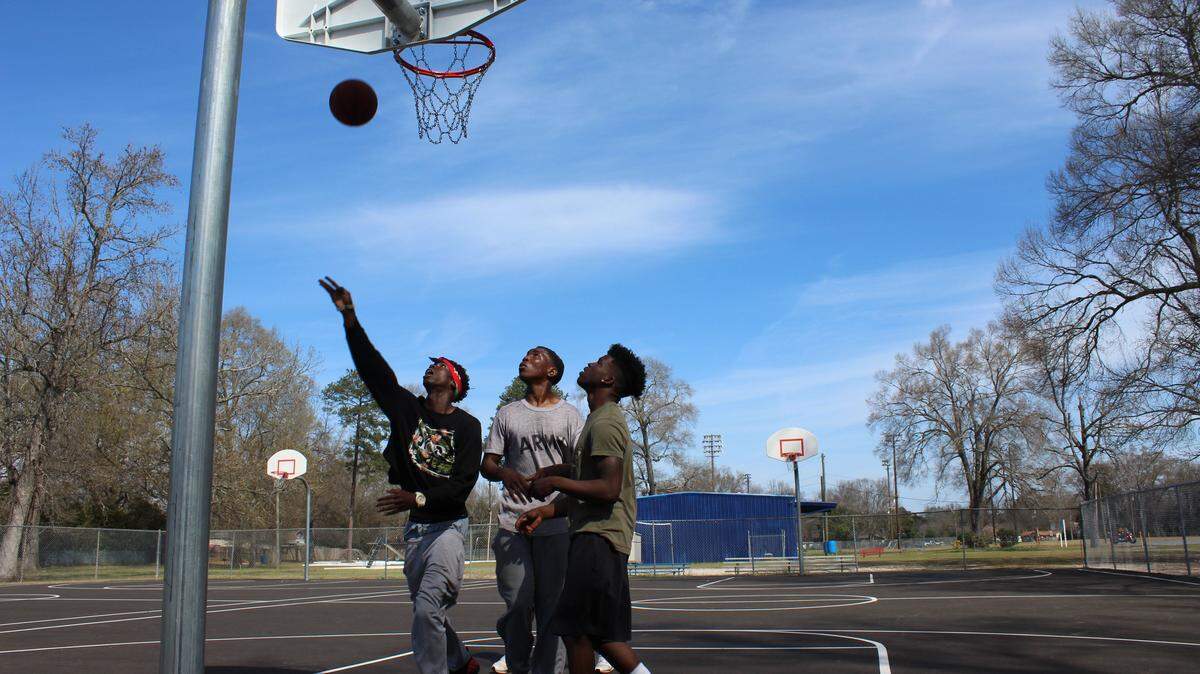 Young people play basketball at the newly renamed Deloris Toliver Park on March 8 ,2016, in Warner Robins. The park will get a new basketball gym as the county upgrades its recreation centers and parks.