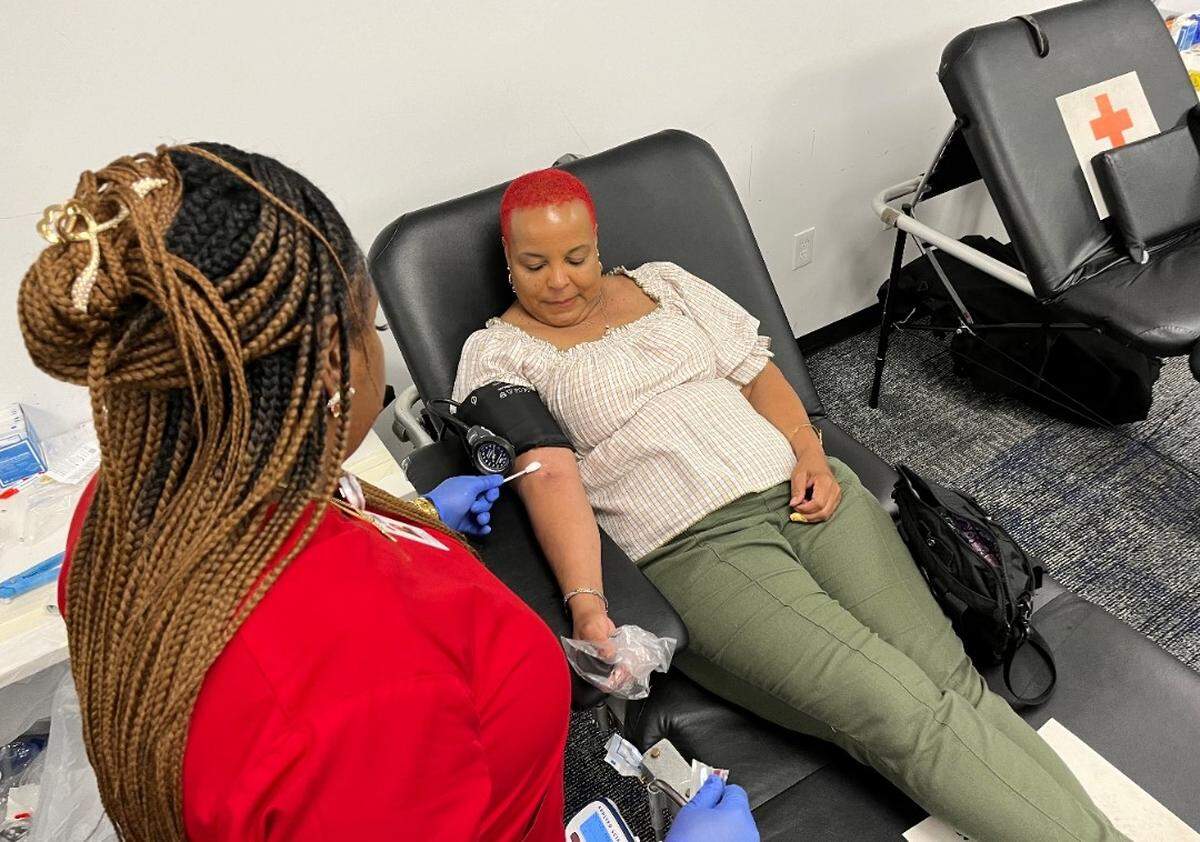 Renee Pless gives blood at a Macon American Red Cross center at Lakeside Commons. Red Cross officials say summer is a crucial time for donations.