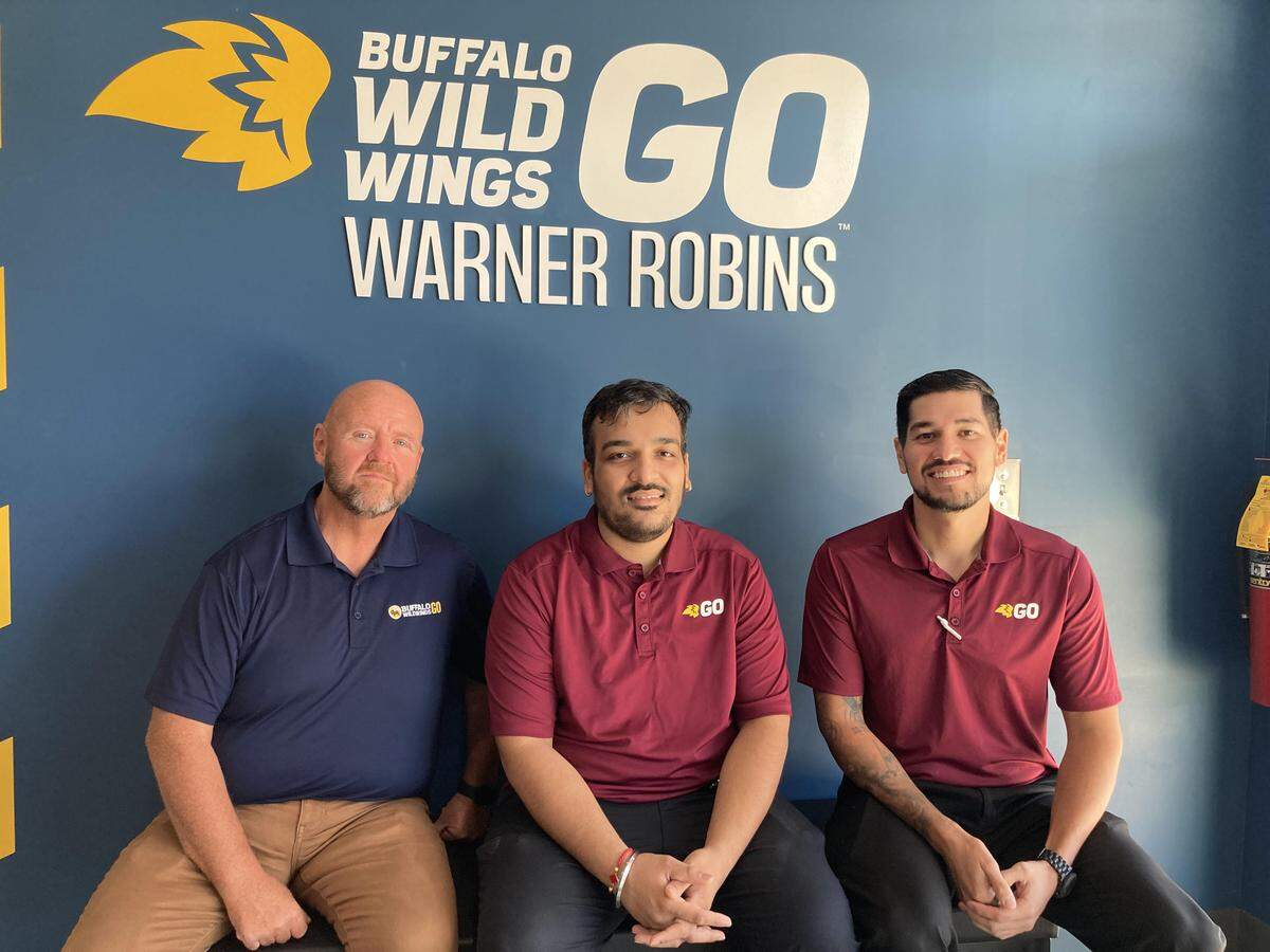 Middle Georgia’s first Buffalo Wild Wings Go opens in Warner Robins. From left to right, Ron Wade, corporate director of restaurant growth, Abhi Patel, the new store’s general manager, and Oscar Garcia, corporate operations training manager, Monday, Aug. 25, 2025.