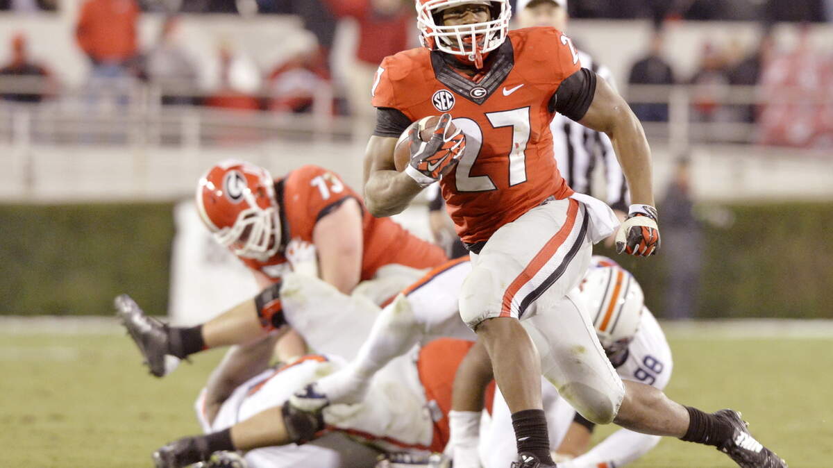 Georgia tailback Nick Chubb (27) could be in the Heisman Trophy mix this season, running behind a strong offensive line.