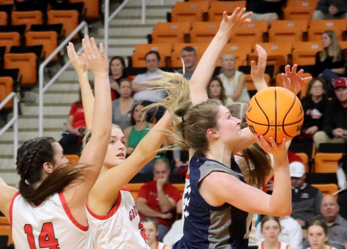 Stratford’s Reagan Ray puts up a shot through the George Walton Academy defense. during their GIAA semifinal game Wednesday night at Mercer.