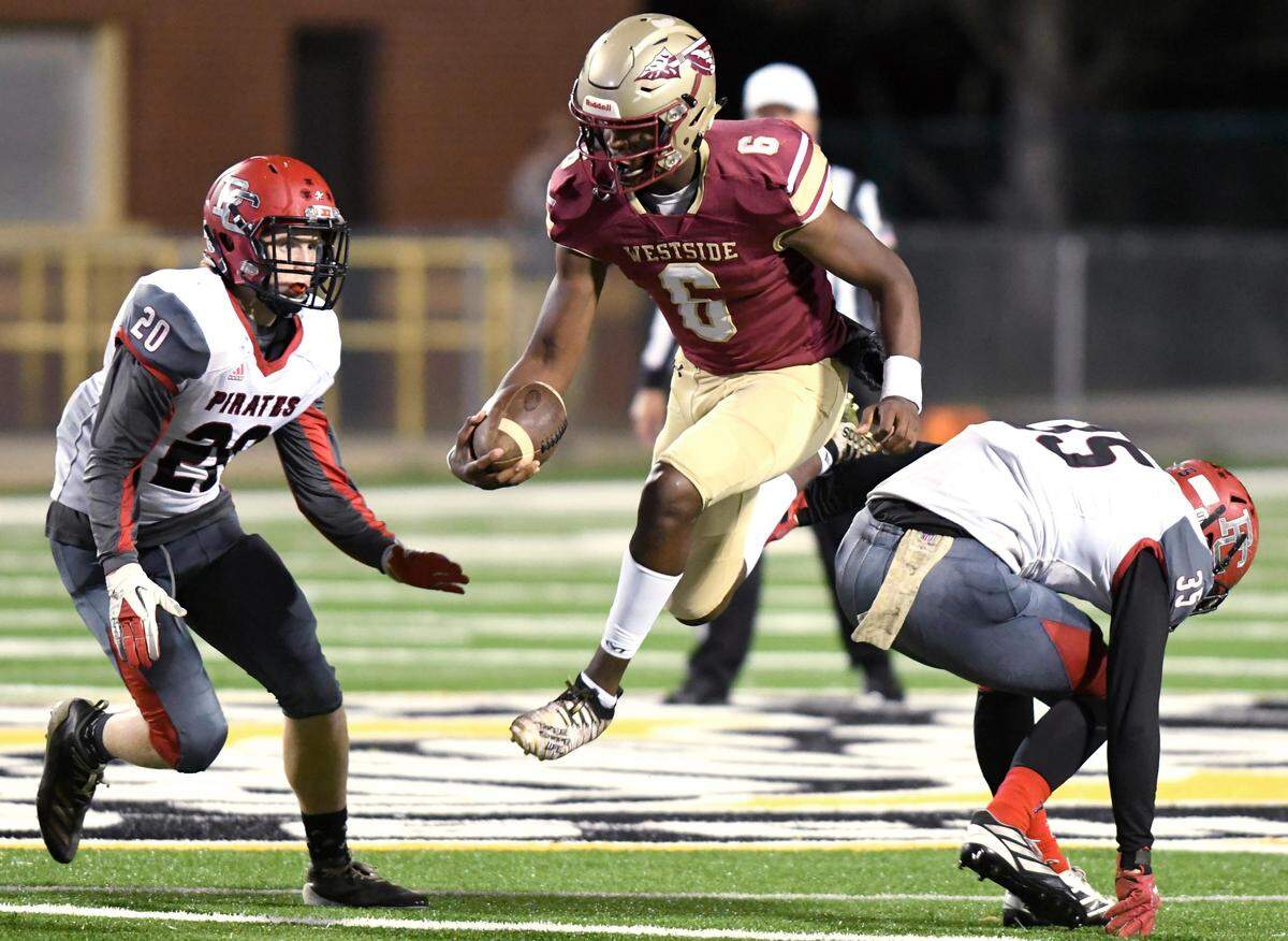 Westside quarterback Victor Dixon Jr. (6) runs through a hole in the Pike County defense during their game Nov. 1, 2019.