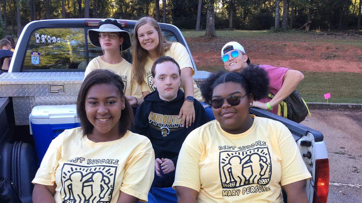 Best Buddies members at Mary Persons High School get ready this fall to ride in the homecoming parade.