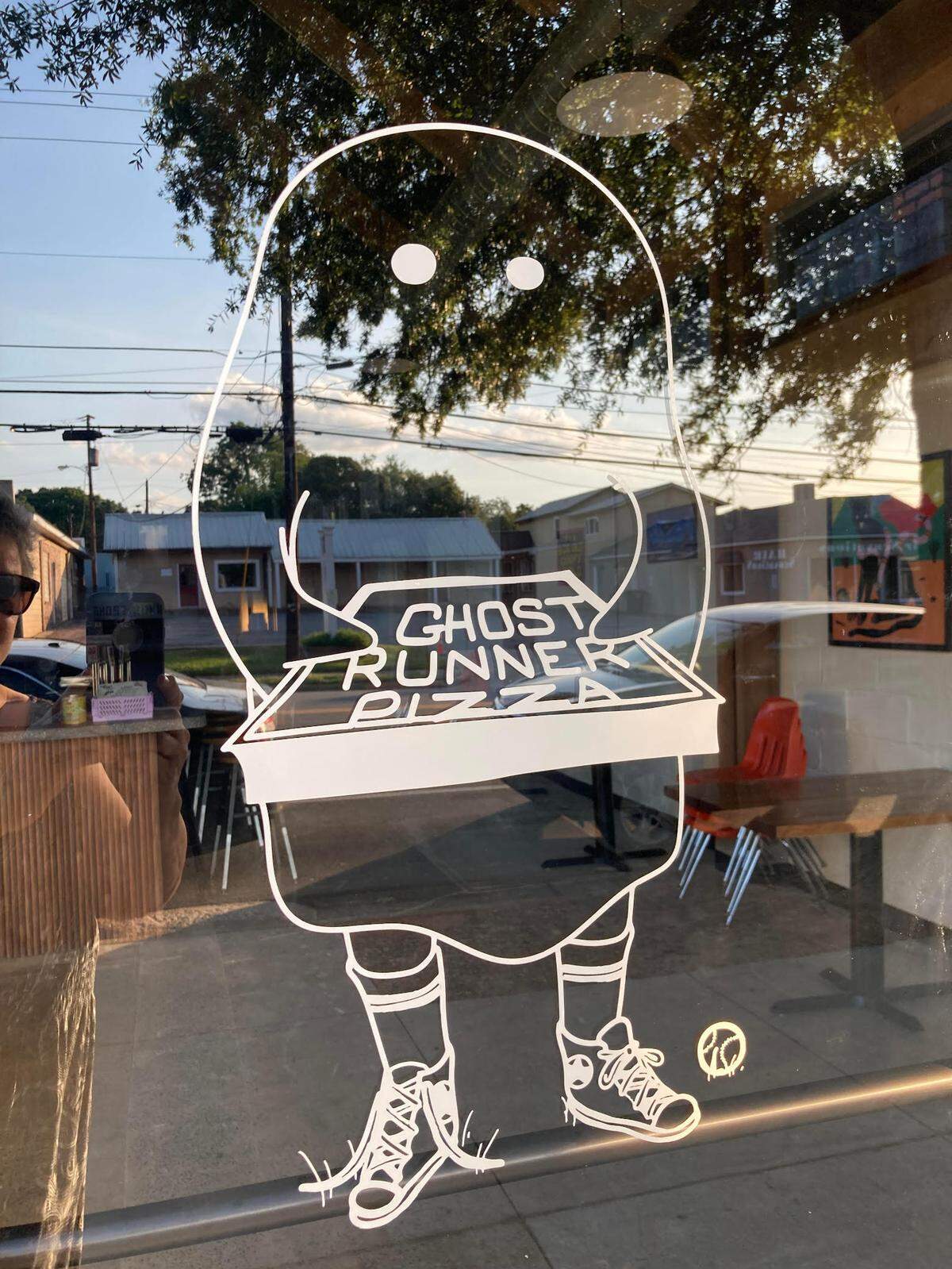 Ghost Runner Pizza is known for their sourdough pizza crust, unique name coined from childhood backyard baseball games and logo of a ghost wearing tennis shoes and holding a pizza box.