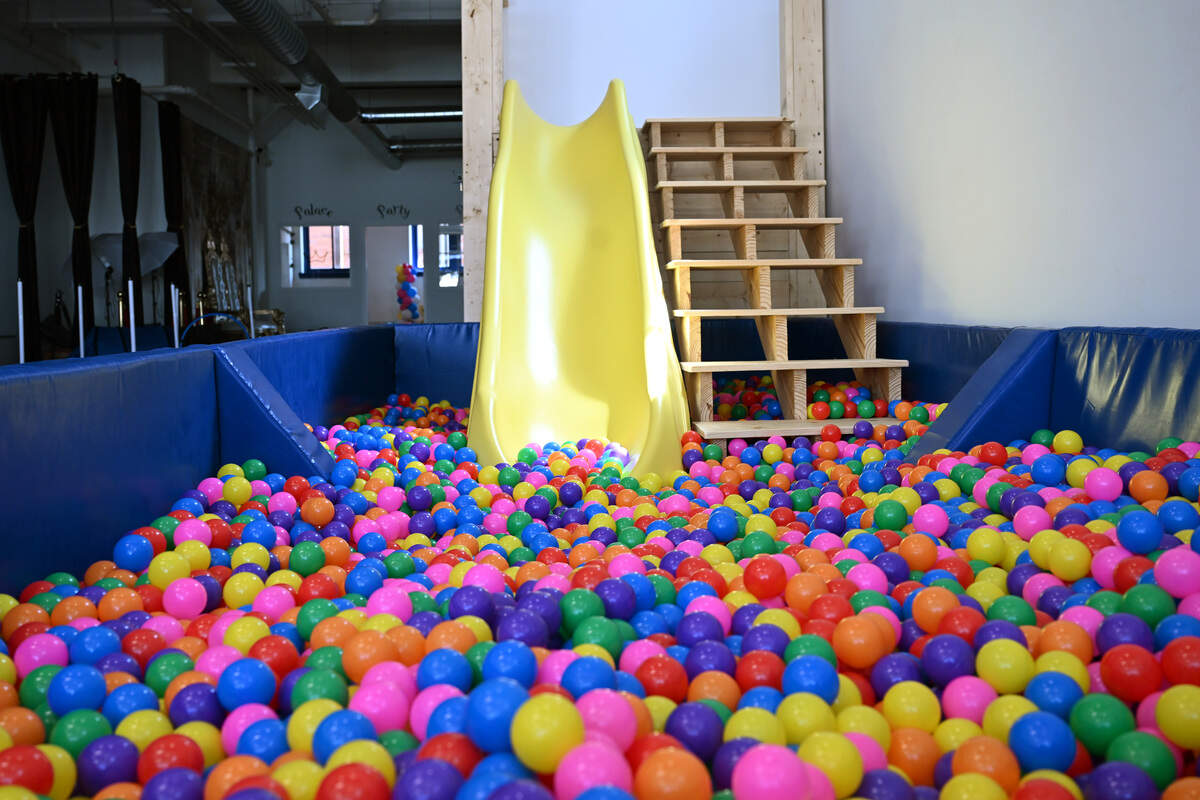A ball pit and slide sit inside of Pet Party Palace on Tuesday, Sept. 16, 2025, in Macon, Georgia. Pet Party Palace began business in May in downtown Macon and offers an indoor party space and photography studio for animals.