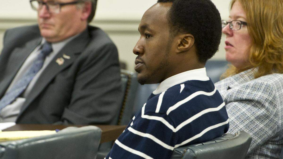 Chris Campbell watches his attorney, Lars Anderson, make his opening statement to jurors in Judge Jeffrey B. Hanson's courtroom Monday.