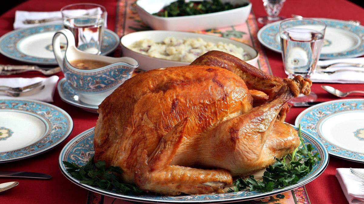 A 20 pound dry-brined turkey was rubbed with salt and placed in a refrigerator for 2 days before being roasted at 450 degrees, than at 350 degrees, at 10 minutes per pound.