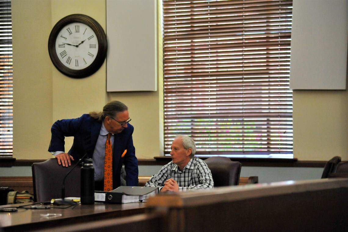 David Lee Billings, right, confers with his lawyer, Franklin J. Hogue, during a break in Billings’ murder trial in Peach County Superior Court on April 26, 2022.