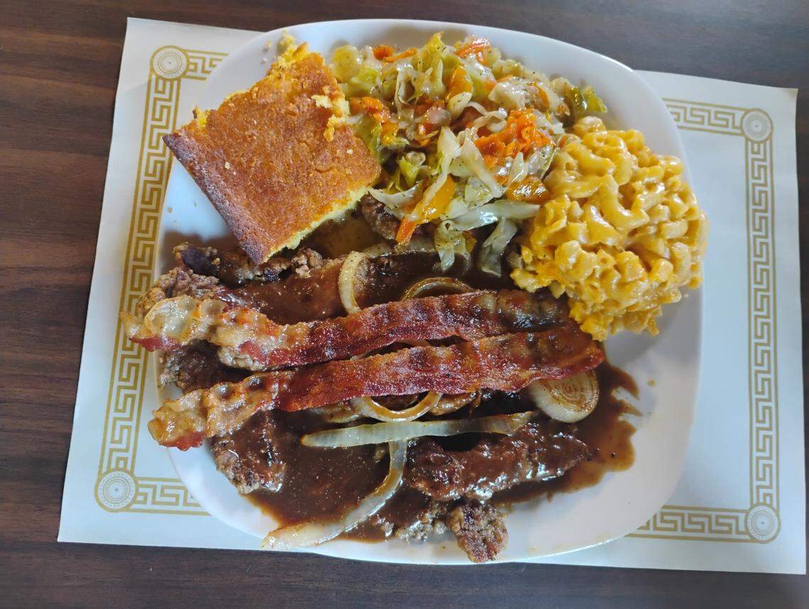 Liver and onions with a side of cabbage, mac and cheese, and cornbread from Comfort Foods Kitchen & Grill in Warner Robins.
