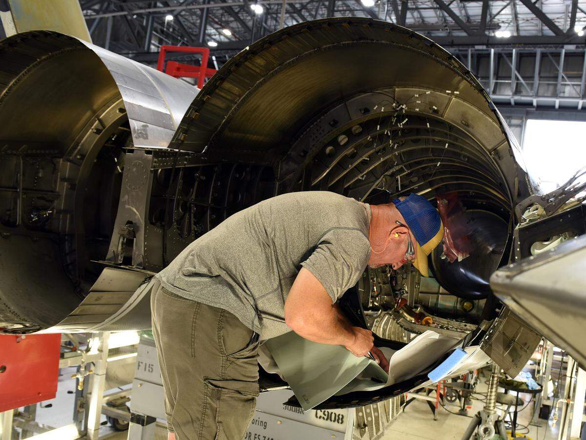Chet Jones, 561st Aircraft Maintenance Squadron sheet metal mechanic, fits a part for an F-15 Eagle aircraft tail cone at the Warner Robins Air Logistics Complex at Robins Air Force Base, Georgia, June 8, 2021. The 561st AMXS accomplishes inspection, modification, maintenance and repair on F-15 aircraft. (U.S. Air Force photo by Tommie Horton)