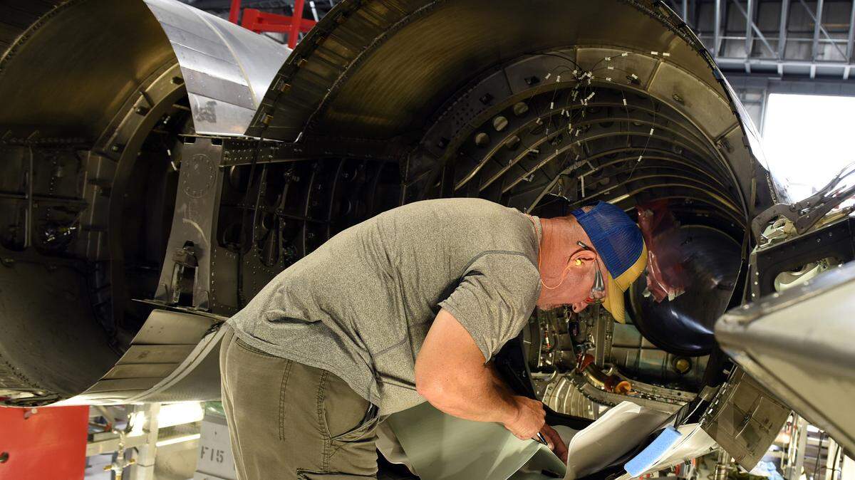 Chet Jones, 561st Aircraft Maintenance Squadron sheet metal mechanic, fits a part for an F-15 Eagle aircraft tail cone at the Warner Robins Air Logistics Complex at Robins Air Force Base, Georgia, June 8, 2021. The 561st AMXS accomplishes inspection, modification, maintenance and repair on F-15 aircraft. (U.S. Air Force photo by Tommie Horton)