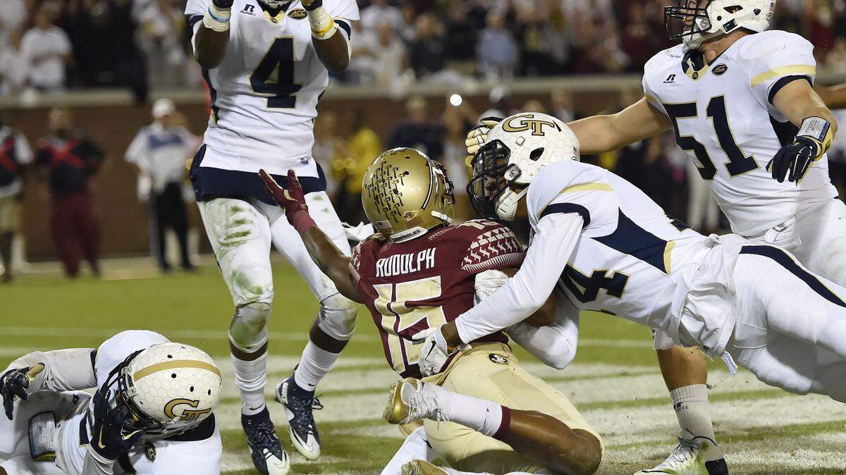 Georgia Tech defensive back Jamal Golden (4) picks off a ball from Florida State wide receiver Travis Rudolph (15) during the second half of Saturday's game.