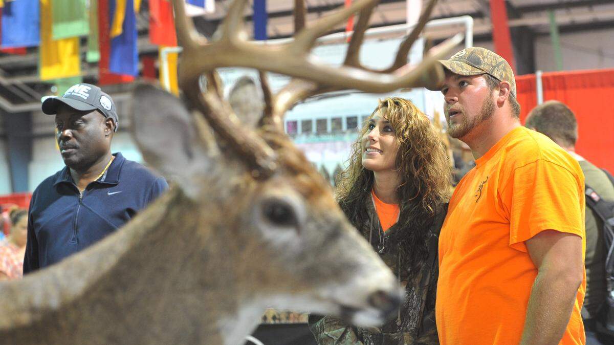 BEAU CABELL/ THE TELEGRAPHChuck Brown, right, and Heather Holloman enjoy a taxidermy exhibit at a previous year’s Buckarama. This year’s event will include educational opportunities, a section for young hunters, the Southeastern Reptile Rescue show and more.