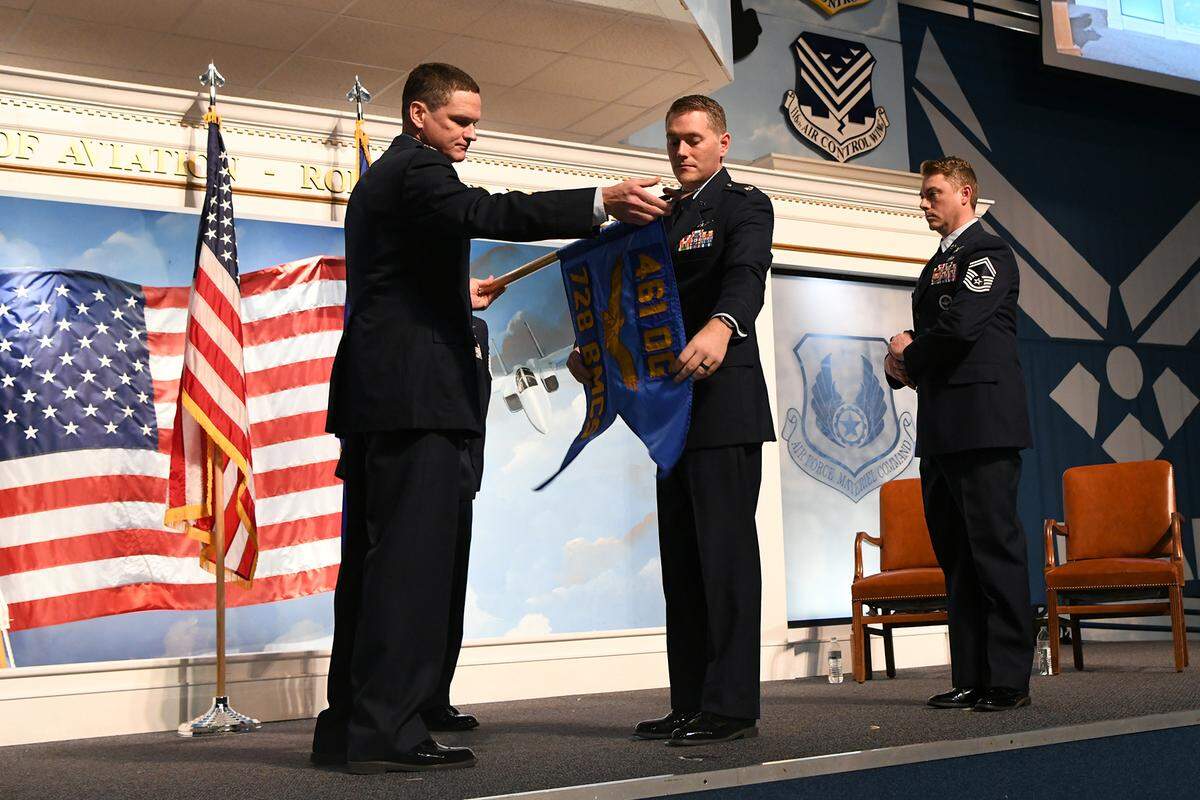 ROBINS AIR FORCE BASE, Ga. – Col. Keith McGuire, 461st Operations Group commander, and Lt. Col. Joshua Gulbranson, 728th Battle Management Control Squadron commander, unfurl the 728th BMCS guidon during the 728th BMCS activation ceremony and assumption of command ceremony held at the Museum of Aviation Feb. 13, 2023, at Robins Air Force Base, Georgia. Gulbranson assumed command of the newly activated unit, which will provide command and control of aircraft in U.S. Central Command. (U.S. air Force photo by Tommie Horton)