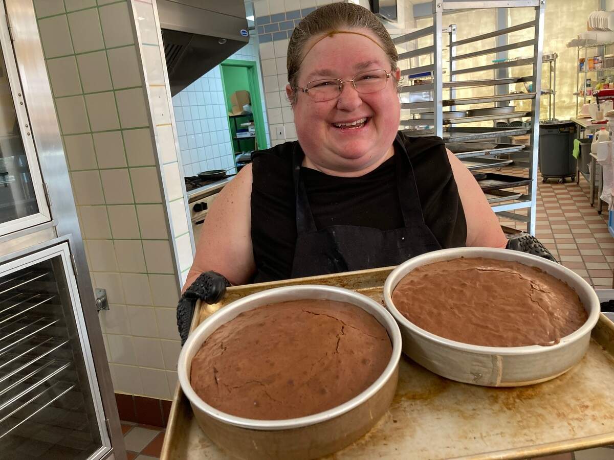 Reia Collins, co-owner of Layers, with brownie cakes fresh out of the oven.