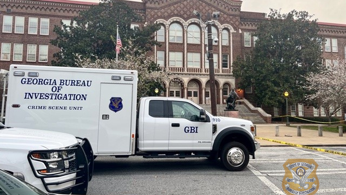 A school officer told the mom to drop the handgun and shot her when she didn’t comply, according to police.