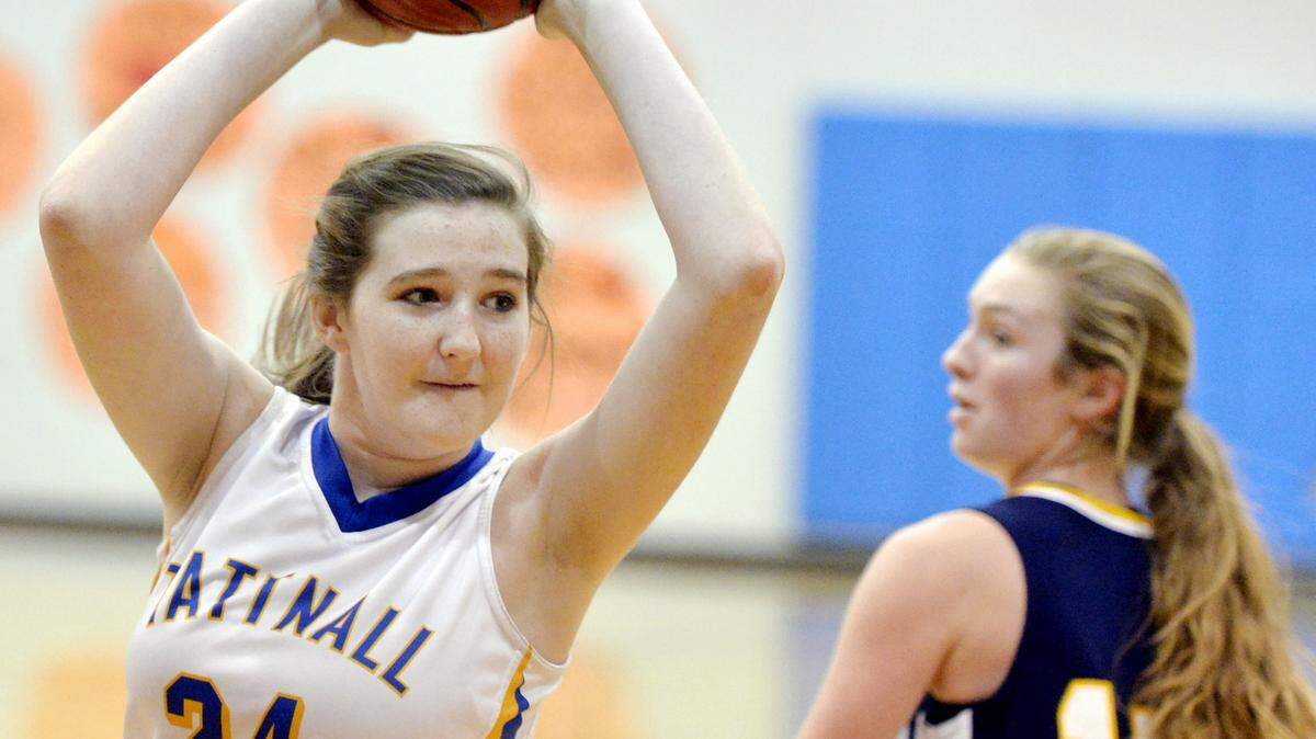 Tattnall Square's Zannah Herndon (24) looks to pass to a teammate after a defensive rebound during the Trojans' game against Mount de Sales on Friday night.