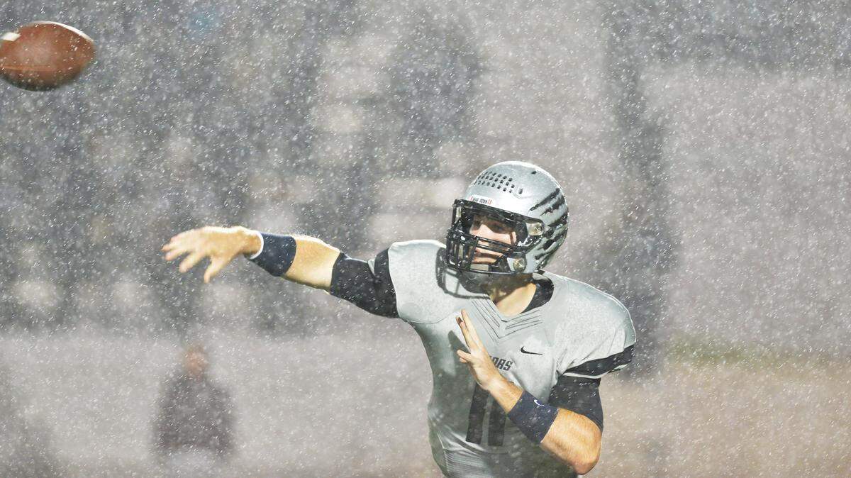 BEAU CABELL/THE TELEGRAPH 
 Warner Robins, Ga., 09/25/2015: A torrential rain didn't seem to bother Houston County quarterback Jake Fromm--or his receivers.