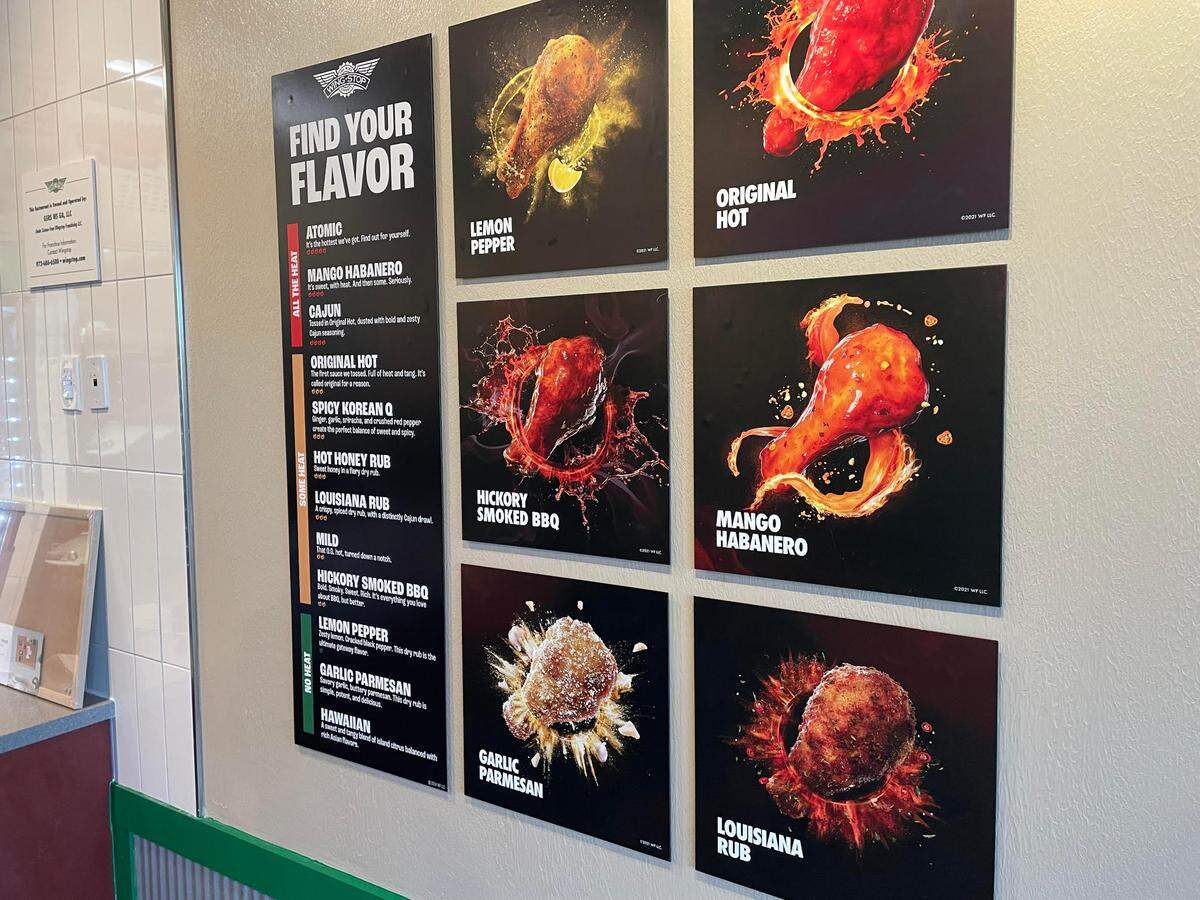 Flavor options on a menu board at the new Wingstop in Perry.