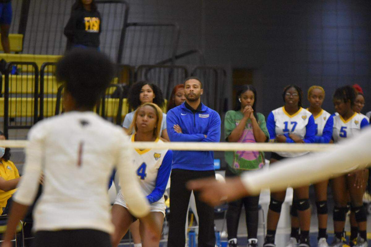 Fort Valley State University volleyball coach Larry Wrather (center) during a women’s volleyball game last season. Wrather and the Wildcats’ men’s volleyball team will kick off their inaugural season Friday night.