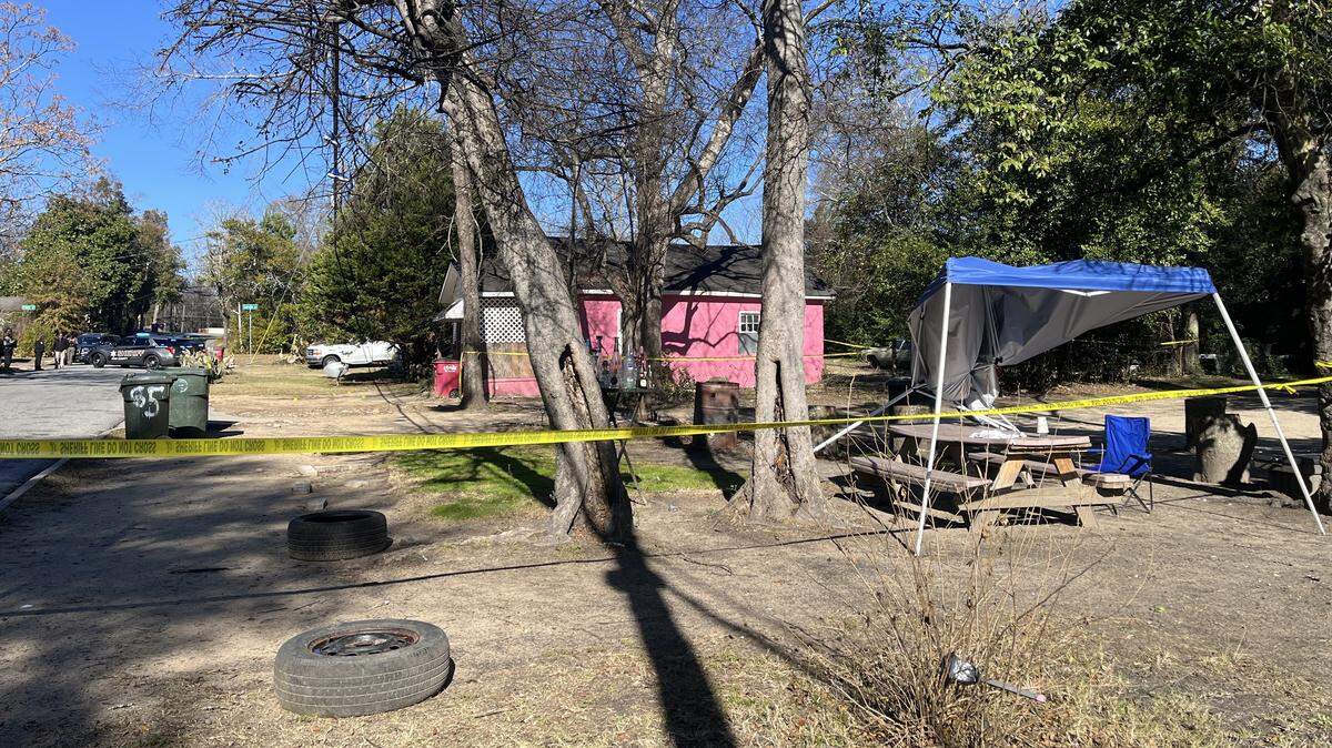 Crime scene tape surrounded the yard where a 38-year-old man was shot and injured on Friday, Dec. 19, 2025, in Macon, Ga., according to the Bibb County Sheriff’s Office.