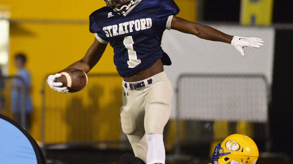 Stratford’s Quintez Cephus (1) celebrates beating Tattnall’s Calvin Slaughter to catch a touchdown pass from Sim Patrick (7).