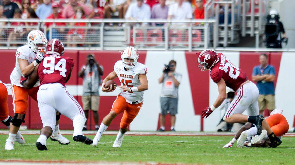 Mercer quarterback Carter Peevy scrambles for positive yardage against the Crimson Tide Saturday afternoon in Tuscaloosa.