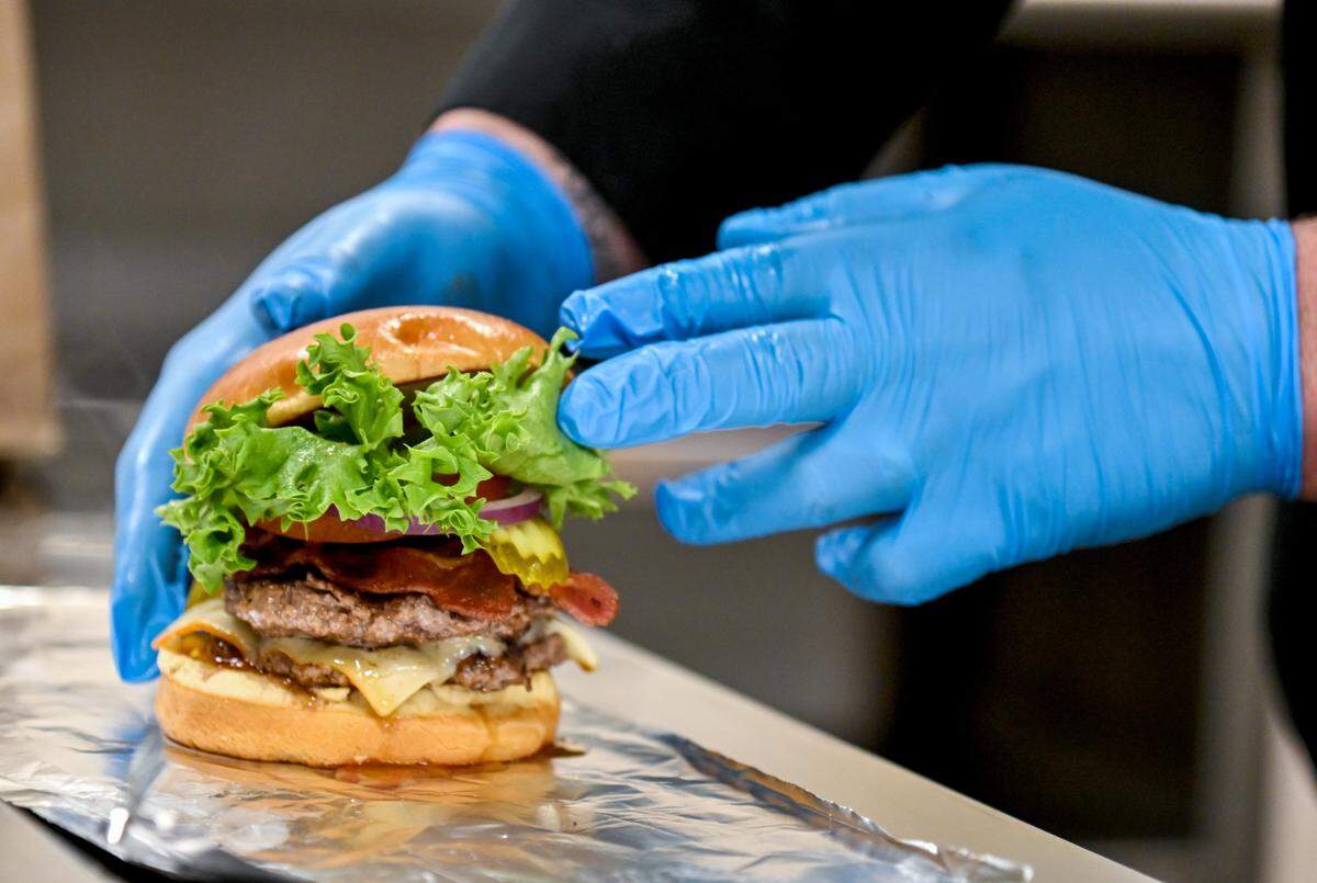 The Keene’s famous steak burger at Keene’s Kafe sells for $12 and features two Angus steak patties, muenster cheese, bacon, lettuce, red onion and pickles on a brioche bun along with a side of fries.