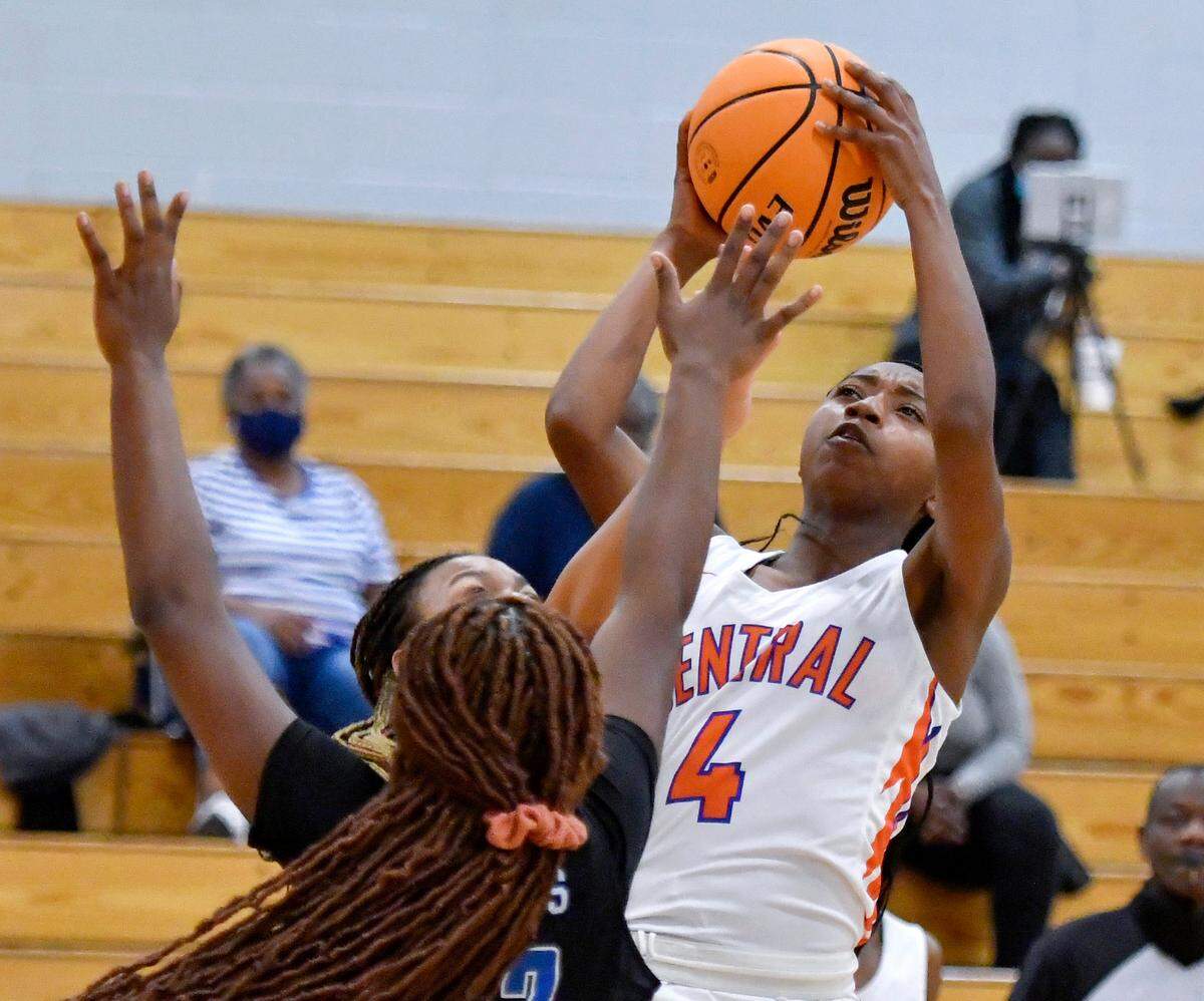 Central’s Taniya Pryor (4) puts up a jumper over Burke County defenders during the Lady Chargers’ 55-40 win in their first round playoff game February 22.