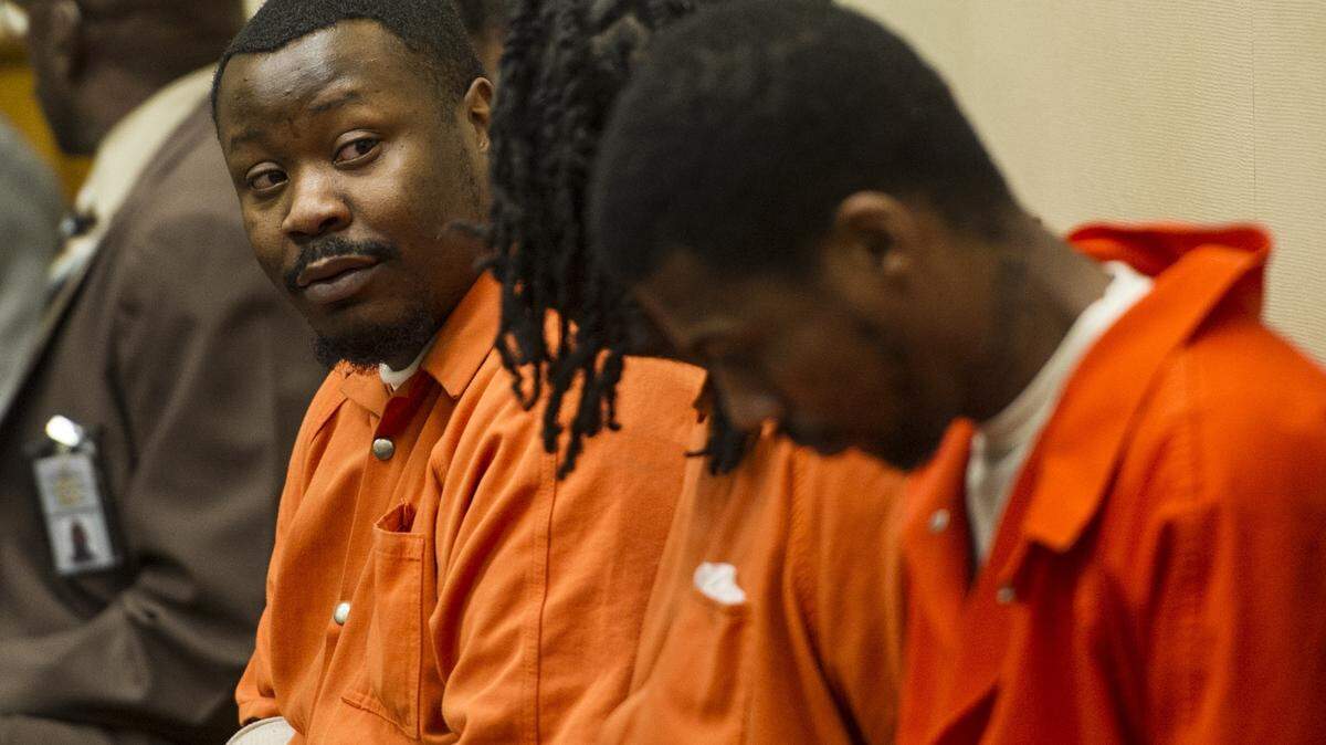 Emmanuel McGhee, one of the defendants in the Wings Cafe melee and shooting that resulted in the death of three men, waits for the pre-trail hearing to begin Tuesday.