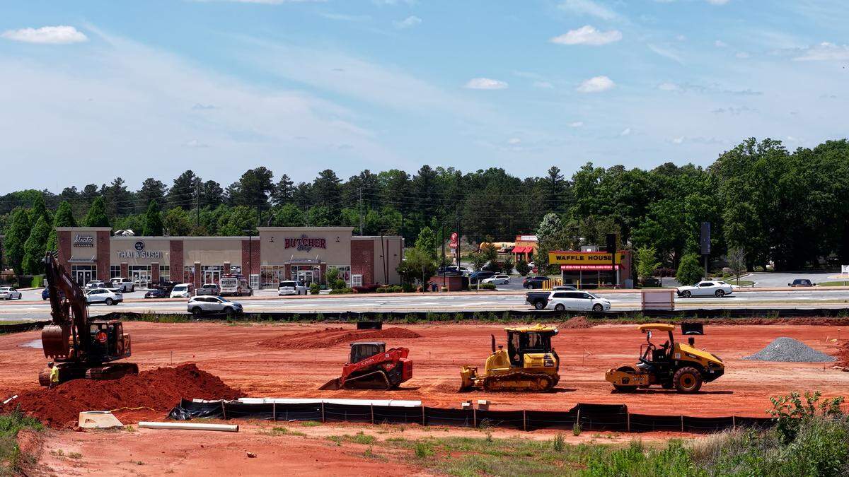 Construction crews prepare the way for a new building being marketed as a possible restaurant and a new shopping center on Tuesday, May 5, 2026, off of GA-96 in Warner Robins, Georgia. 